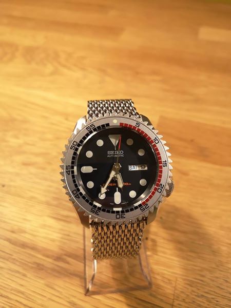 My modified Seiko SKX 009 with a shark bezel, sapphire glass, new seconds hand and a mesh strap. Really cool and raw look, and only one in the world!